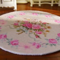 Miniature shabby chic Victorian rug with a soft floral pattern featuring pink roses.