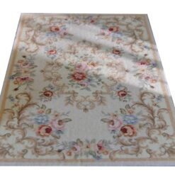 Ivory Floral Scroll Miniature Rug 10 Ivory miniature rug with soft floral scroll patterns in pink, blue, and beige.