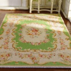 Miniature Aubusson rug with floral medallion and green background
