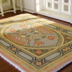 Modern abstract miniature rug with bold patterns in pink, black, blue, and green.