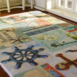 Miniature coastal rug featuring nautical elements like anchors, lighthouses, and starfish in pastel tones.