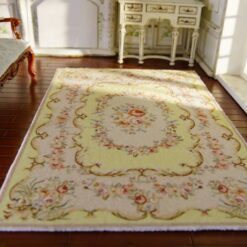 Yellow Aubusson style miniature rug with floral pattern and scroll detailing