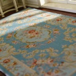 Victorian Miniature Rug - Soft Blue with Floral Medallion Design 9 Miniature Victorian rug in soft blue featuring a central floral medallion surrounded by scrollwork.
