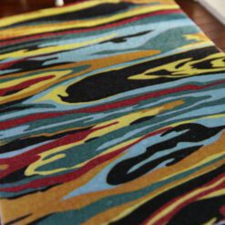Modern abstract miniature rug with colorful flowing pattern