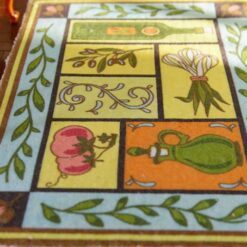 Mediterranean-style miniature rug with olive oil bottles, tomatoes, and vines.