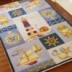 Miniature dollhouse rug with nautical symbols and lighthouse designMiniature dollhouse rug with nautical symbols and lighthouse design