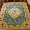 Miniature dollhouse rug in French Aubusson style with powder blue background