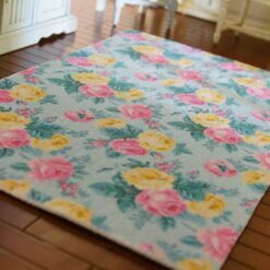 Miniature dollhouse rug with pink and yellow roses on mint background