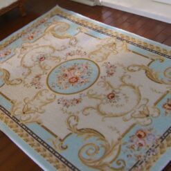 Victorian miniature rug in blue with floral medallion