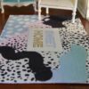 Modern abstract rug with pastel colors and "SWEET HOME" text