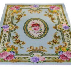 Elegant Blue Victorian Floral Rug for Dollhouses 10 Victorian-style miniature rug with light blue background and floral roses, featuring scrolls and a central medallion.
