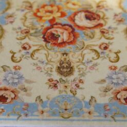 French Aubusson Blue Floral Miniature Rug 11 French Aubusson-style miniature rug with a light blue background, floral bunches, and a cream-colored floral medallion.