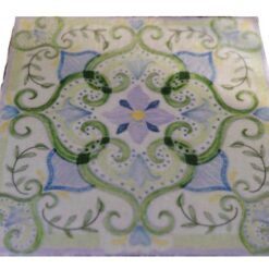 Pastel green miniature rug with swirls, vines, and floral accents, perfect for modern dollhouse interiors.