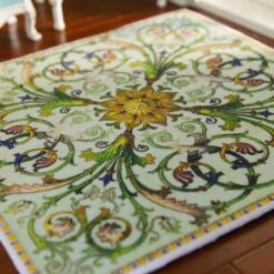 Green miniature rug with sunflower medallion, birds, and swirling floral vines, perfect for nature-inspired dollhouses.