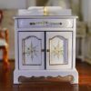 Victorian miniature vanity sink with floral hand-painted design and gold accents