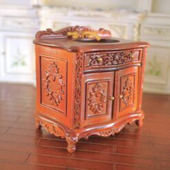Baroque-style miniature vanity sink with gold faucet