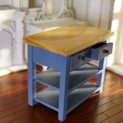 Blue miniature kitchen island with a wooden top and open shelves.