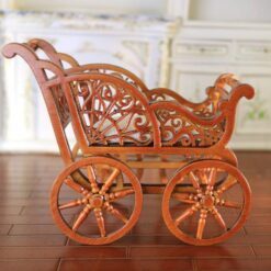 Miniature Victorian wooden baby carriage with cushion