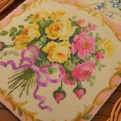 Bright yellow and pink roses surrounded by golden flourishes, a miniature Aubusson tapestry.