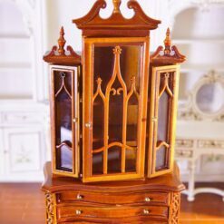 Miniature Gothic-style display cabinet with glass doors and mahogany finish.