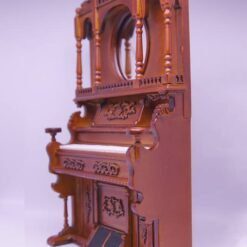 Victorian-style miniature wooden organ with mirror and carvings