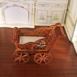 Miniature Victorian wooden baby carriage with cushion