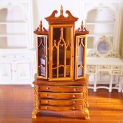 Miniature Gothic-style display cabinet with glass doors and mahogany finish.