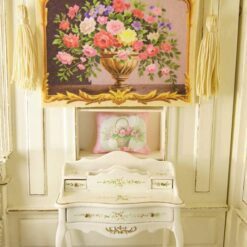 Miniature Aubusson tapestry featuring a sculpted urn with vibrant roses and lush greenery.
