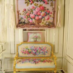 Romantic floral arrangement with roses and vines in a golden vase, a miniature Aubusson tapestry.