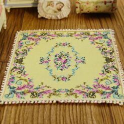 Elegant square Victorian miniature rug with floral details in soft pastel colors, perfect for your dollhouse.