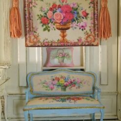 Golden urn filled with roses and flowers framed by an intricate floral border, a miniature Aubusson tapestry