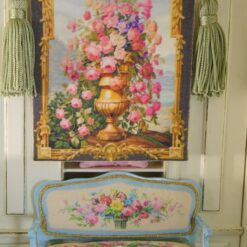 Golden vase overflowing with roses and wildflowers framed by intricate gold, a miniature Aubusson tapestry.