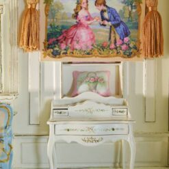 A romantic proposal scene with a couple in vintage attire, surrounded by roses and framed with gold, a miniature Aubusson tapestry.