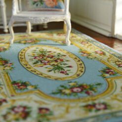 Blue Victorian floral rug with red roses and gold accents