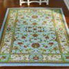 Modern Persian Miniature Rug with Intricate Floral Pattern 1 Modern Persian rug with a floral pattern and warm color palette for a contemporary look.