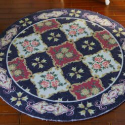 Modern French Aubusson miniature rug with intricate floral motifs in soft blues and golds