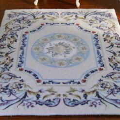 Modern Aubusson-style miniature rug with floral motifs in blue, pink, and cream