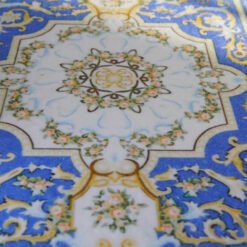 French Louis XV miniature rug with ornate scrolls and floral accents in blue and gold