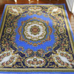 Modern Chinese-inspired miniature rug with floral motifs in blue, red, and gold