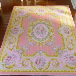 Pastel pink Victorian rug with roses and gold scrollwork