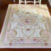 Soft pink Victorian rug with roses and golden swirls