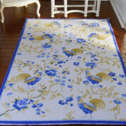 French-style rooster and flower miniature rug in blue and yellow tones