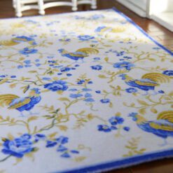 French-style rooster and flower miniature rug in blue and yellow tones
