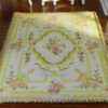 Pastel French Aubusson rug with floral patterns and soft colors