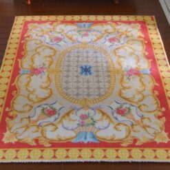 Royal French Aubusson miniature rug with bright floral design Main Colors: Pink, Yellow, Blue, Gold
