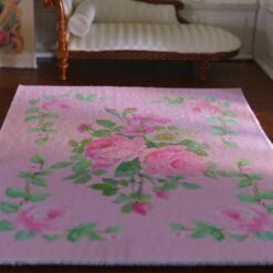 Light blue miniature rug with yellow roses and pink floral details