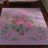 Light blue miniature rug with yellow roses and pink floral details