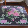 Dark grey miniature rug with pink roses and green vines