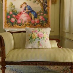 Miniature pillow with pastel floral bouquet and blue ribbon