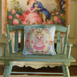 Miniature pillow with fairy piglet surrounded by roses and lavender